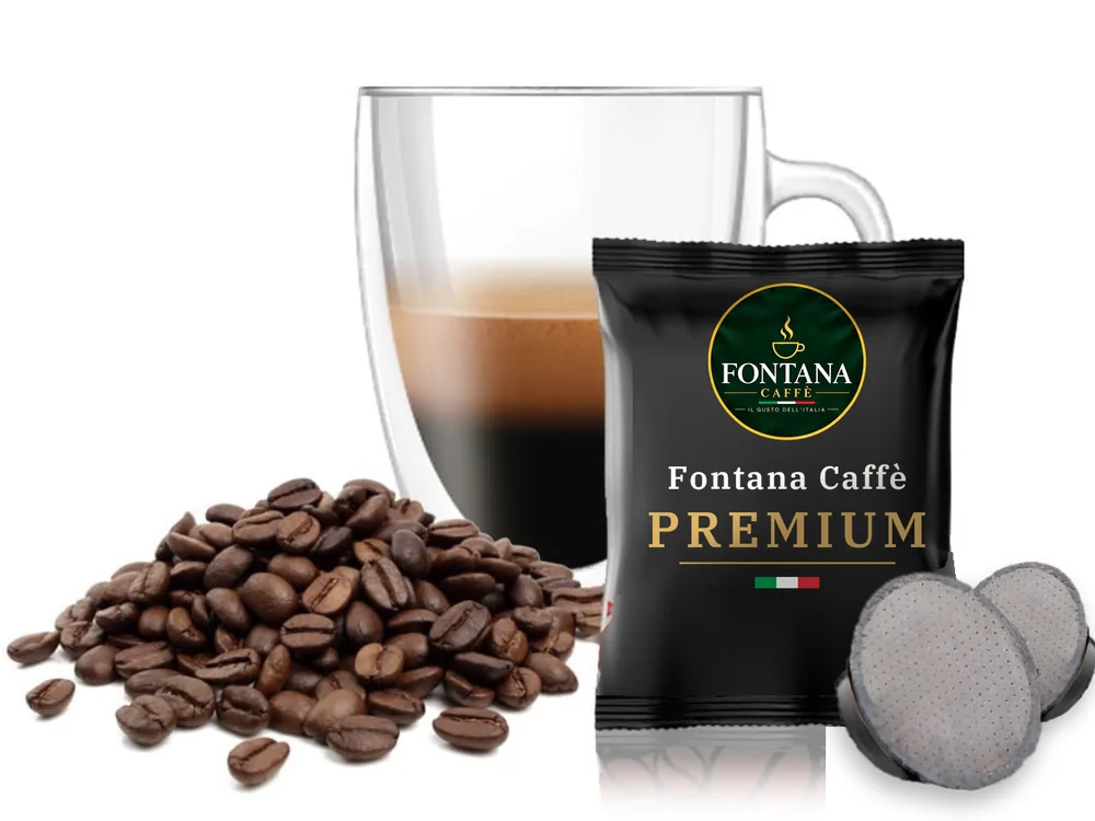 Capsulă compatibilă Lavazza A Modo Mio® cu un plic Fontana Caffè Premium (neagră), pahar de espresso și boabe de cafea